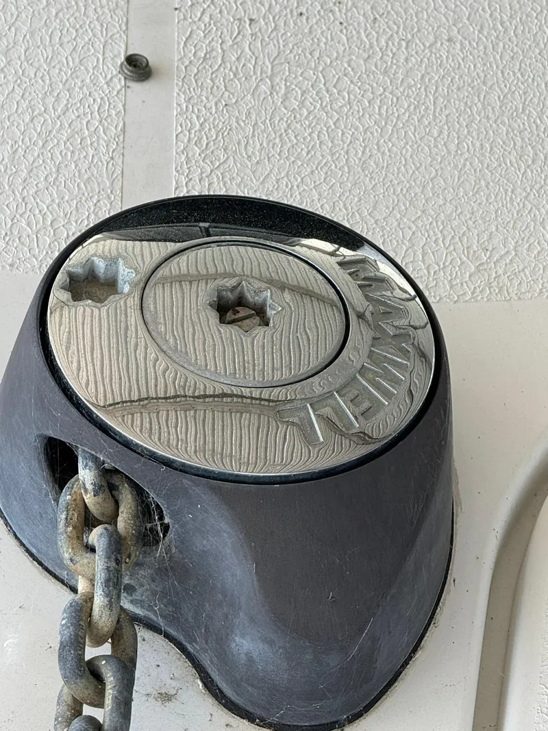 Slide: The Image of Anchor winch on 2000 Carver 350 Mariner boat with chain detail. - 2