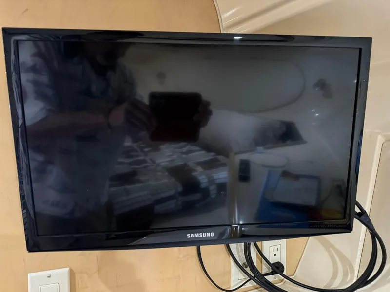 Slide: The Image of Samsung TV mounted inside a 2000 Carver 350 Mariner boat cabin. - 22