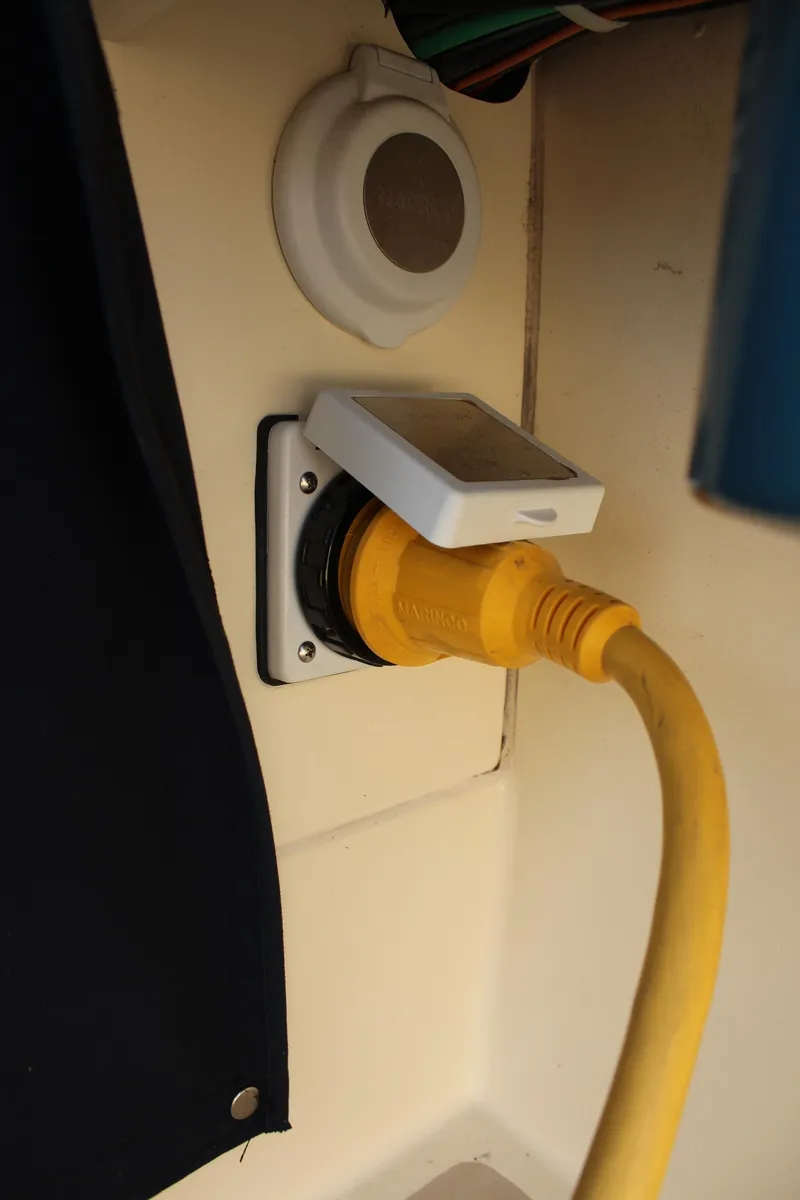 Slide: The Image of Yellow power cable connected to a 2016 Eastern 27' Islander boat outlet. - 15