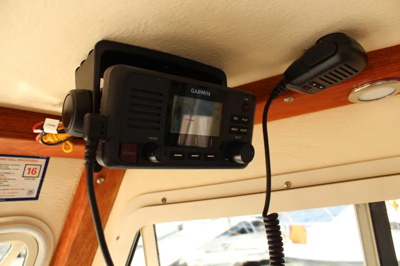 Slide: The Image of Garmin marine radio installed on 2016 Eastern 27' Islander boat ceiling. - 27