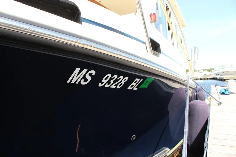 Slide: The Image of 2016 Eastern 27' Islander boat docked, showing registration number MS 9328 BL. - 31