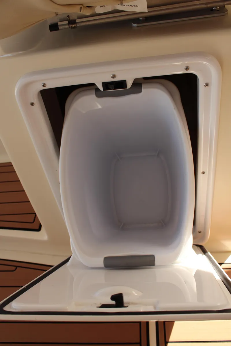 Slide: The Image of Open storage compartment on 2016 Eastern 27' Islander boat. - 33