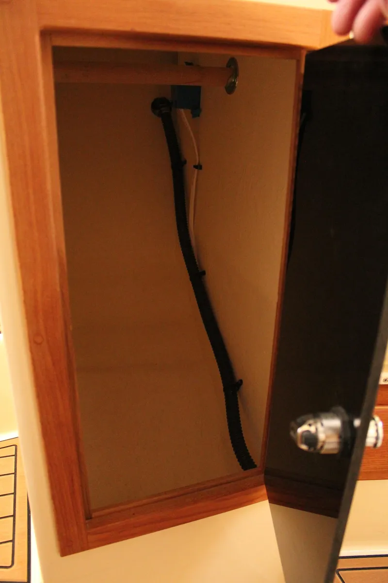 Slide: The Image of Cabinet interior of 2016 Eastern 27' Islander boat, showing plumbing and storage space. - 37
