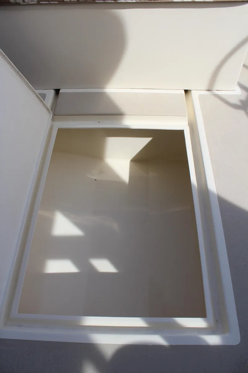 Slide: The Image of Open storage compartment on 2016 Eastern 27' Islander boat. - 39