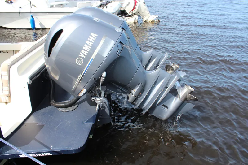 Slide: The Image of Outboard motor on a 2016 Eastern 27' Islander boat in water. - 40