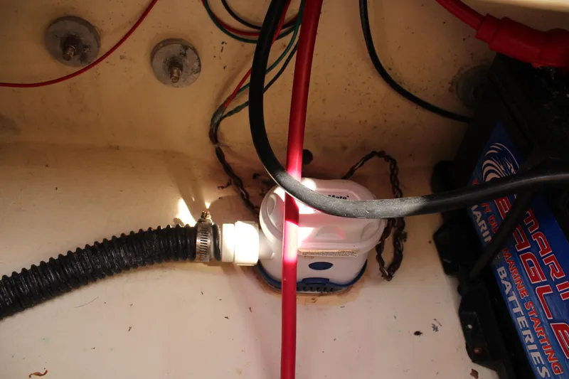 Slide: The Image of Bilge area of a 2016 Eastern 27' Islander boat with wiring and battery. - 47