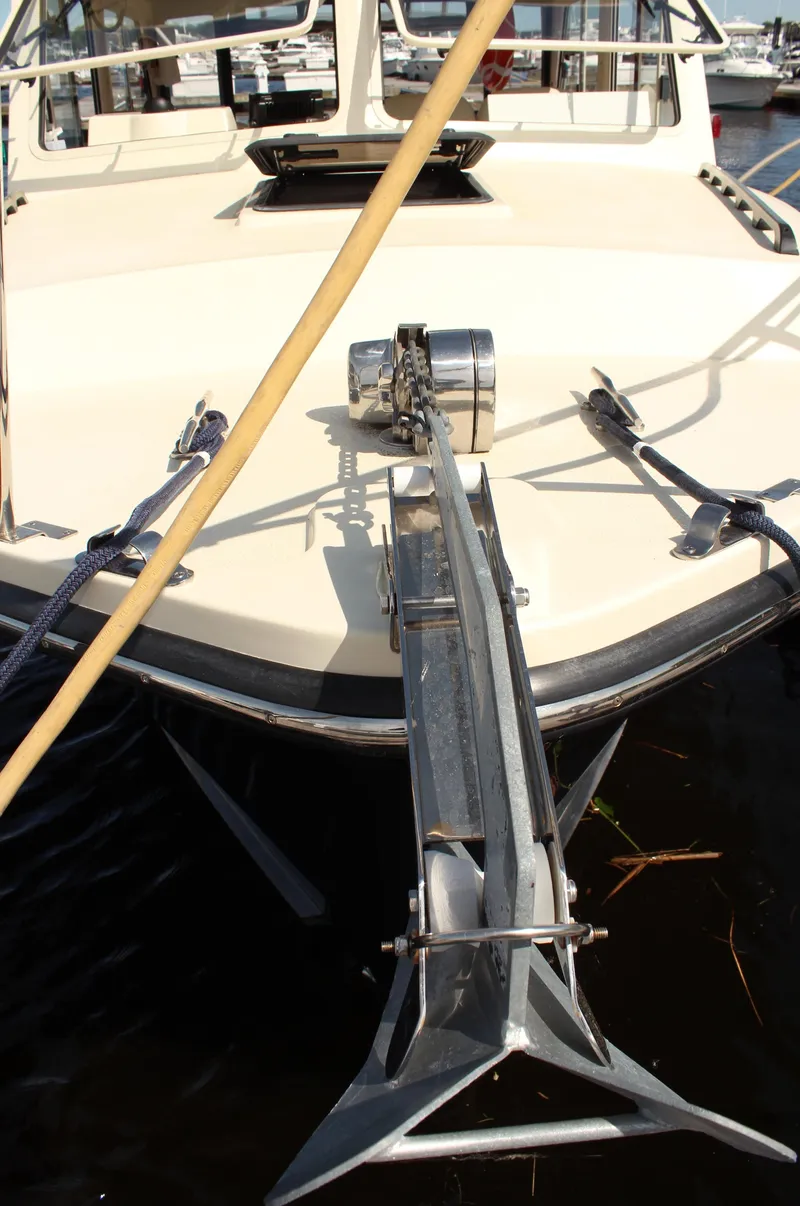 Slide: The Image of 2016 Eastern 27' Islander boat with anchor, docked in marina. - 8