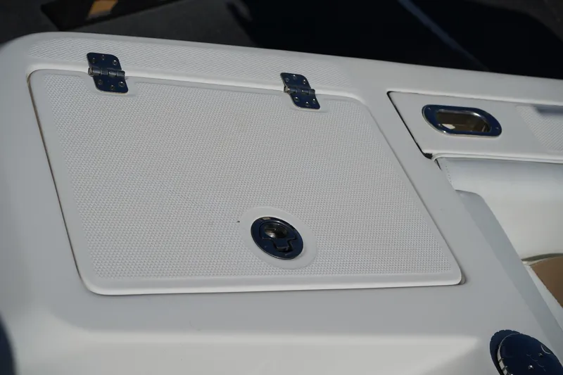 Slide: The Image of 2014 Edgewater 245CC boat hatch with metal hinges and latch. - 11