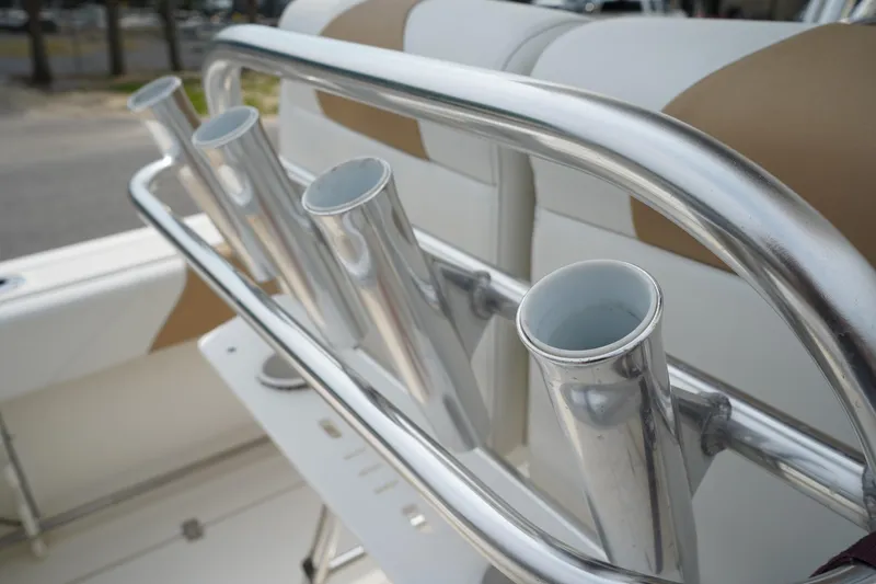 Slide: The Image of Stainless steel rod holders on 2014 Edgewater 245CC boat, featuring sleek design and functionality. - 16