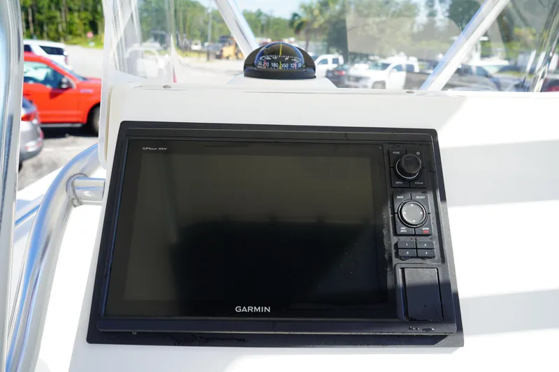Slide: The Image of Garmin GPS display on 2014 Edgewater 245CC boat dashboard with compass. - 31