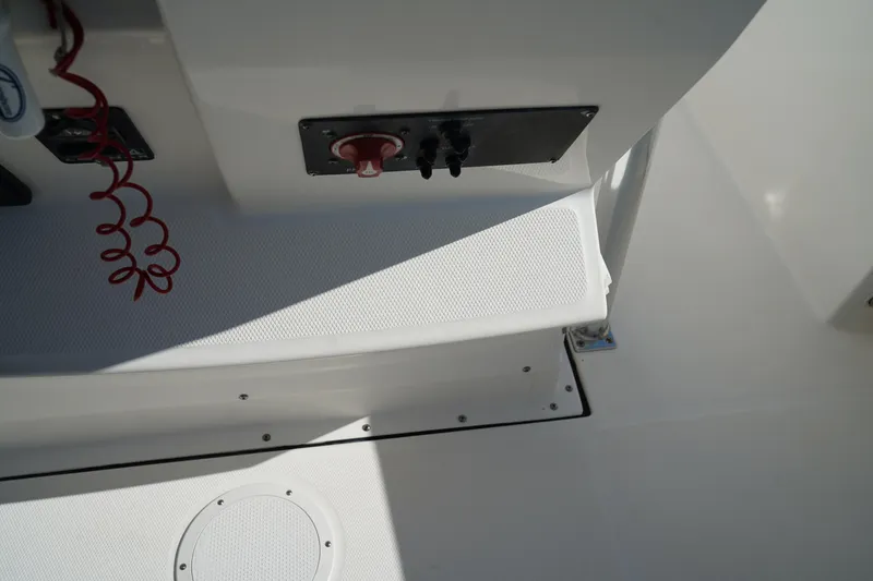 Slide: The Image of Edgewater 245CC 2014 boat interior with control panel and safety features. - 35