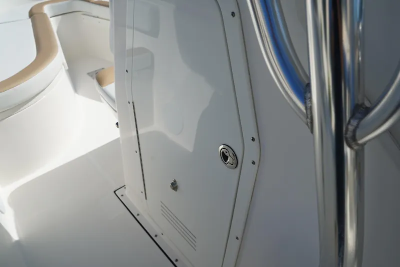 Slide: The Image of Edgewater 245CC 2014 boat interior with sleek white finish and stainless steel details. - 36