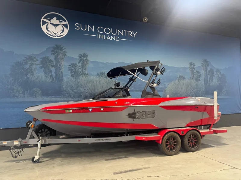 The Image of 2021 Axis A22 boat on trailer at Sun Country Inland showroom. - 1