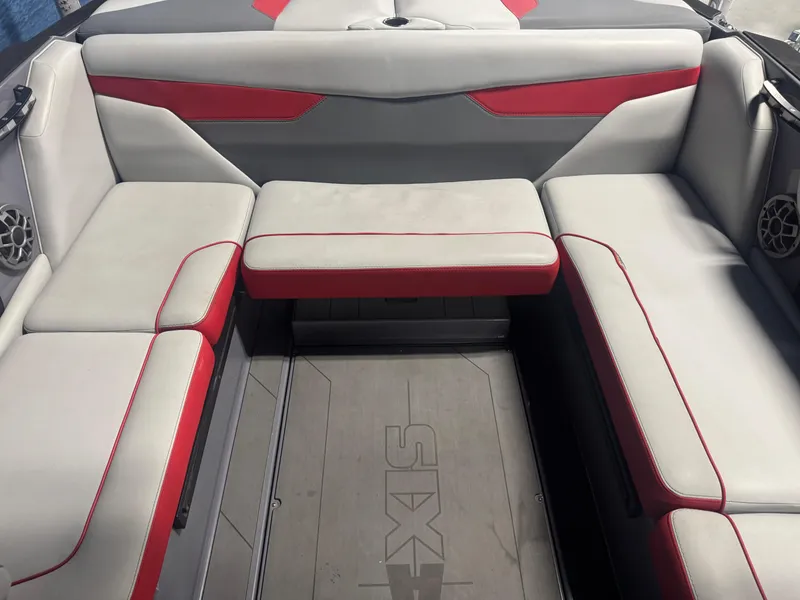 Slide: The Image of 2021 Axis A22 boat interior with gray and red seating. - 9