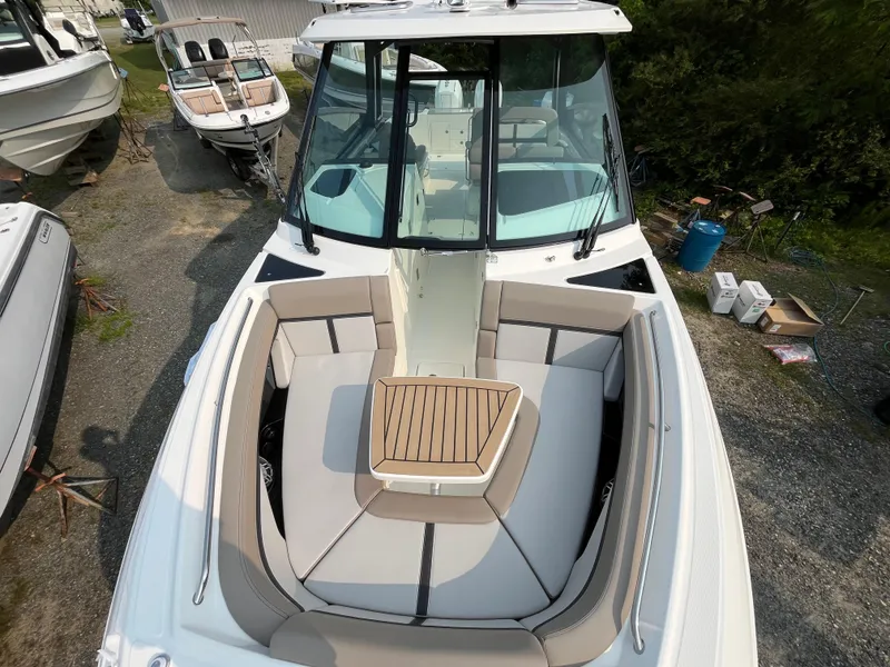 Slide: The Image of 2025 Boston Whaler 330 Vantage boat with spacious seating and sleek design. - 1