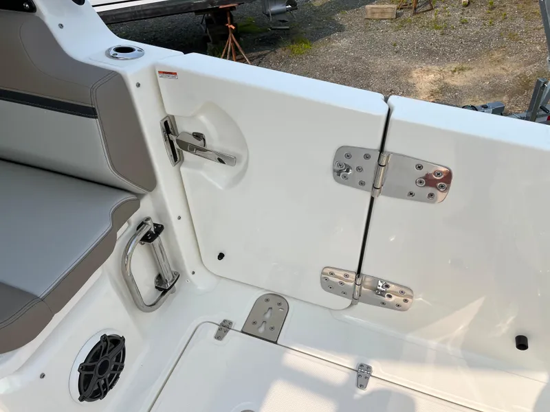 Slide: The Image of 2025 Boston Whaler 330 Vantage boat interior with seating and stainless steel hardware. - 25