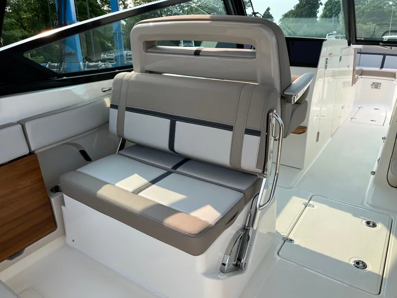 Slide: The Image of 2025 Boston Whaler 330 Vantage interior seating with modern design and luxurious upholstery. - 28