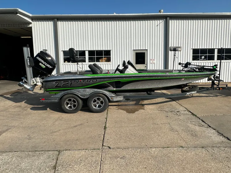The Image of 2017 Nitro Z21 Z-Pro High Performance boat on trailer outside a garage. - 0