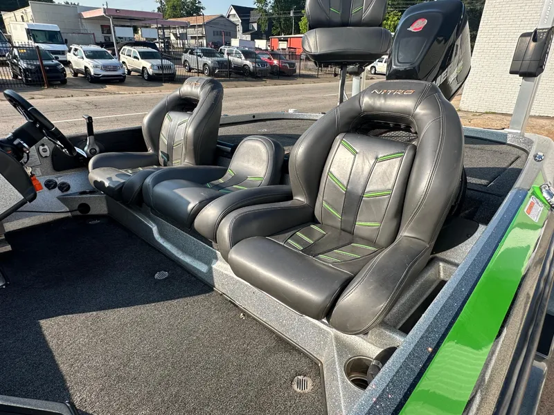 Slide: The Image of 2017 Nitro Z21 Z-Pro High Performance boat interior with sleek black and green seats. - 12