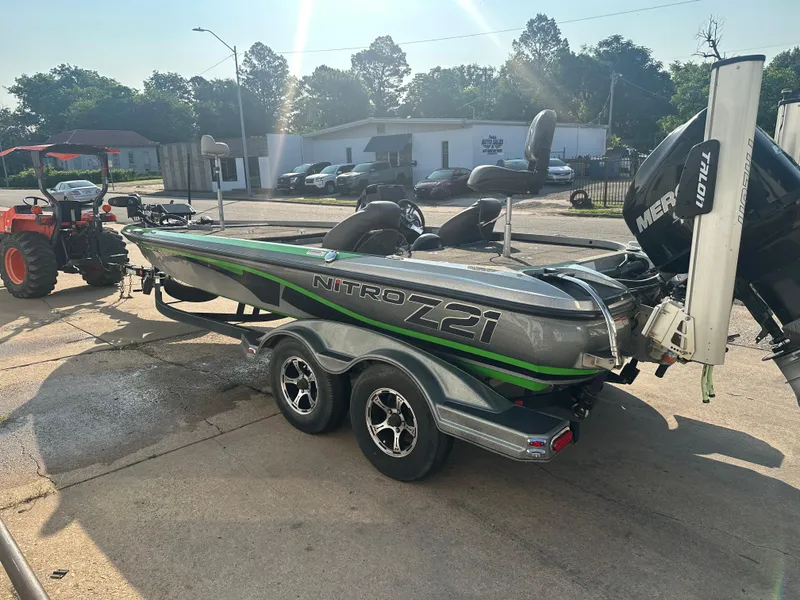 Slide: The Image of 2017 Nitro Z21 Z-Pro High Performance boat on trailer, parked outdoors. - 2