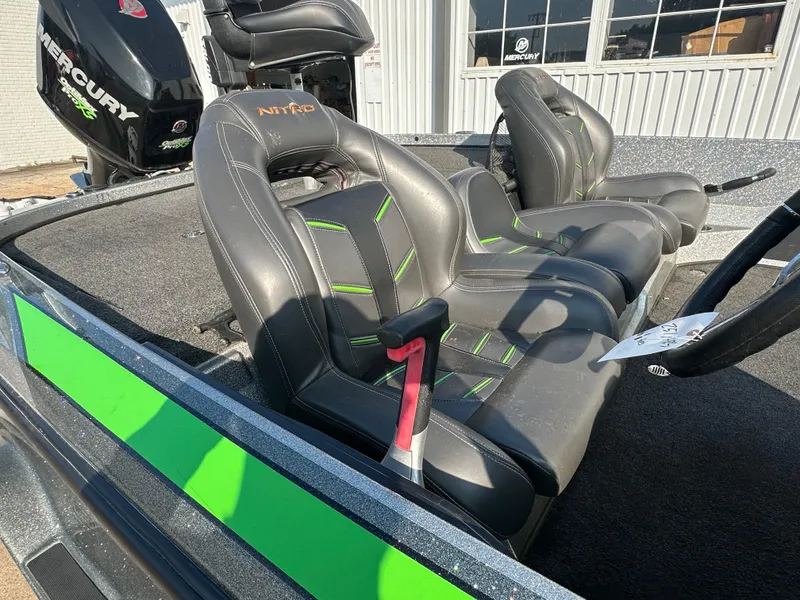 Slide: The Image of 2017 Nitro Z21 Z-Pro High Performance boat seats with green accents and Mercury engine. - 9