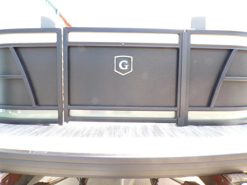 Slide: The Image of 2025 Godfrey Sweetwater 2286 SB pontoon boat, rear view with logo and sleek design. - 14