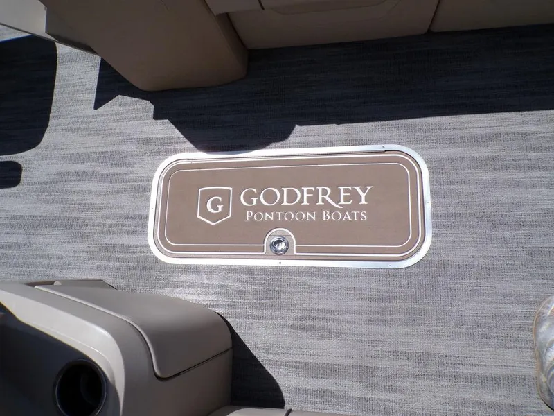 Slide: The Image of 2025 Godfrey Sweetwater 2286 SB boat floor with logo, showcasing luxury design. - 3