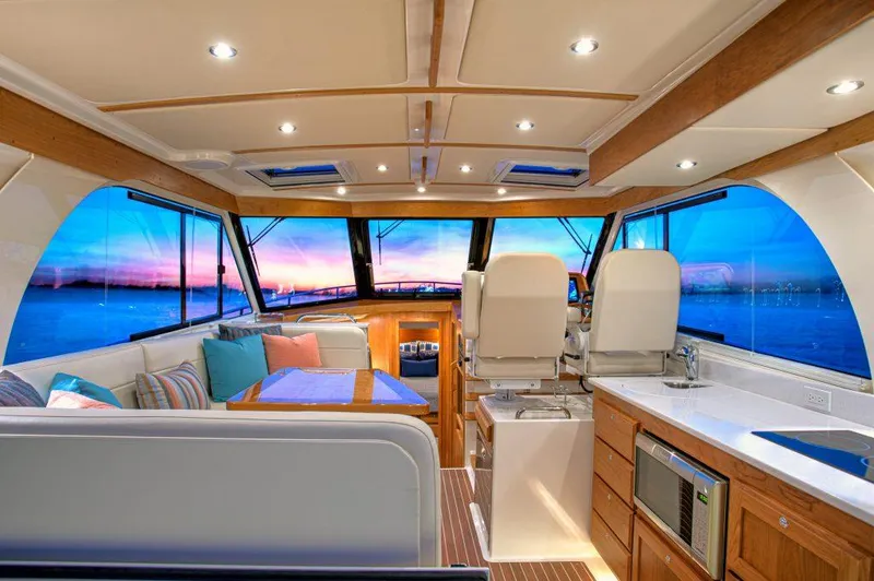 Slide: The Image of Luxurious interior of 2026 Back Cove 39O yacht with sunset view through windows. - 10