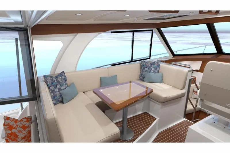 Slide: The Image of Luxurious interior of 2026 Back Cove 39O yacht with plush seating and elegant table. - 7