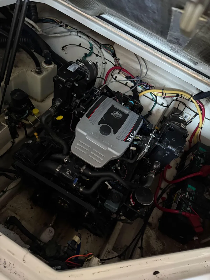 Slide: The Image of Engine compartment of a 2010 Bayliner 255 SB boat, showcasing detailed mechanical components. - 14