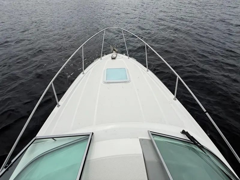 Slide: The Image of Bow view of 2010 Bayliner 255 SB boat on open water. - 23