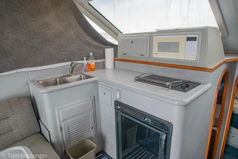 Slide: The Image of Interior of 1996 Mediterranean 38 Convertible yacht with kitchenette and appliances. - 10