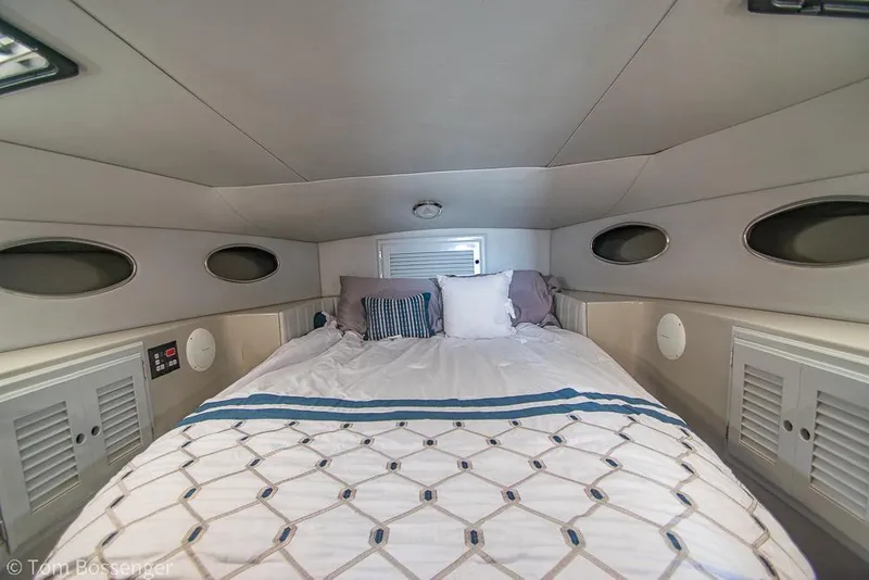 Slide: The Image of Cozy cabin interior of 1996 Mediterranean 38 Convertible yacht with comfortable bedding. - 15