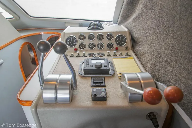 Slide: The Image of Control panel of a 1996 Mediterranean 38 Convertible boat with gauges and levers. - 21