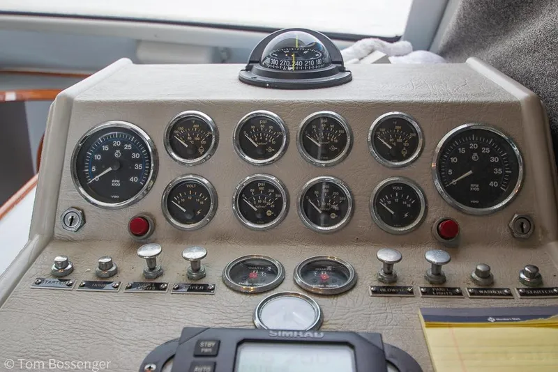 Slide: The Image of Control panel of a 1996 Mediterranean 38 Convertible boat with gauges and switches. - 23
