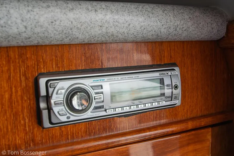 Slide: The Image of 1996 Mediterranean 38 Convertible boat stereo system on wooden panel. - 24