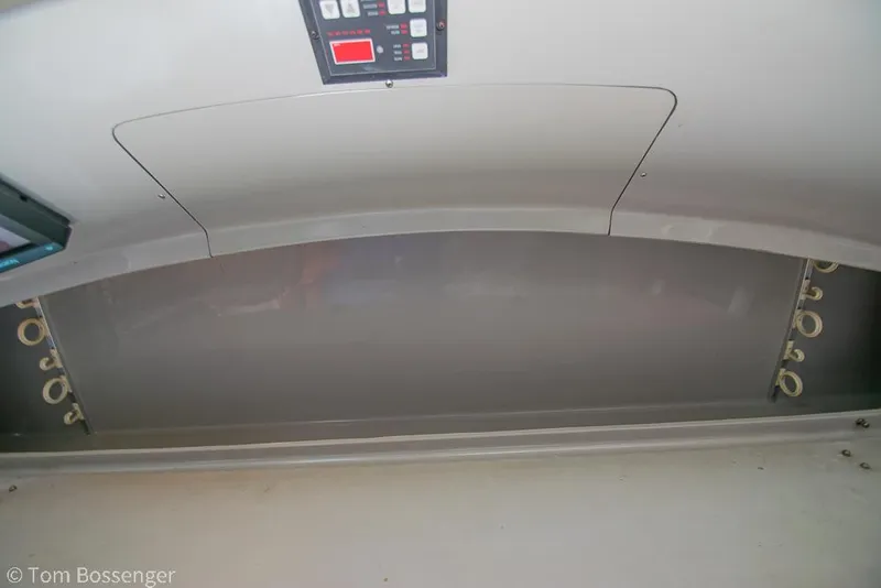 Slide: The Image of Interior view of a 1996 Mediterranean 38 Convertible boat with control panel. - 30