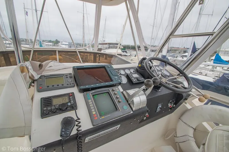 Slide: The Image of 1996 Mediterranean 38 Convertible yacht helm with navigation equipment and steering wheel. - 32