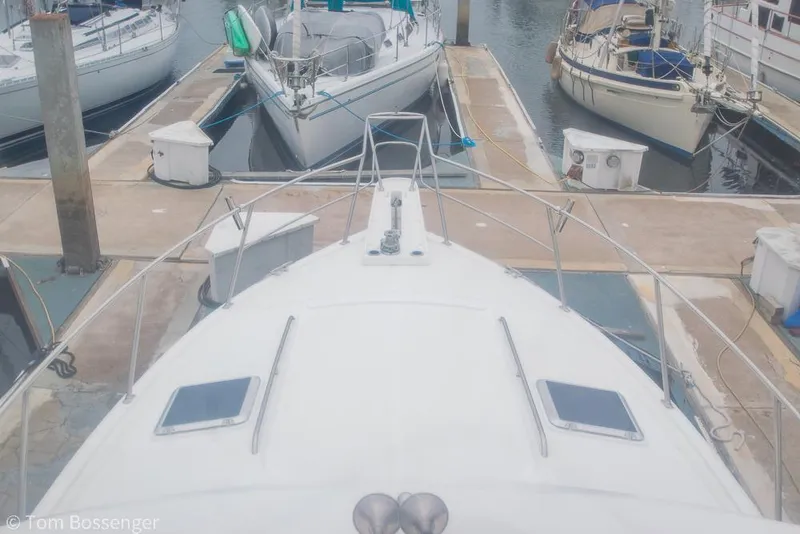 Slide: The Image of 1996 Mediterranean 38 Convertible yacht docked at marina with other boats. - 36