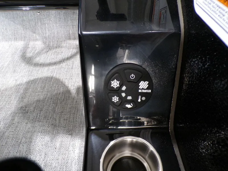 Slide: The Image of Control panel of 2025 Premier 230 Sunsation RL boat with cup holder. - 11