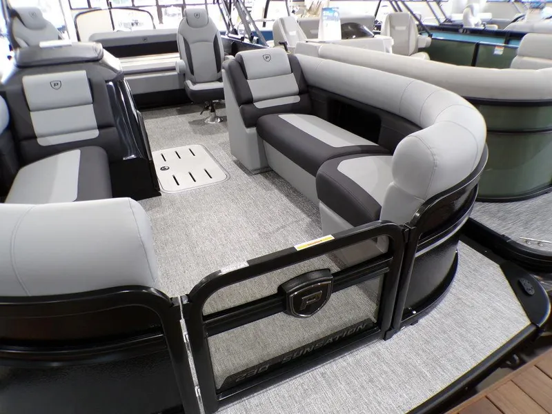 Slide: The Image of 2025 Premier 230 Sunsation RL pontoon boat interior with plush seating and modern design. - 19
