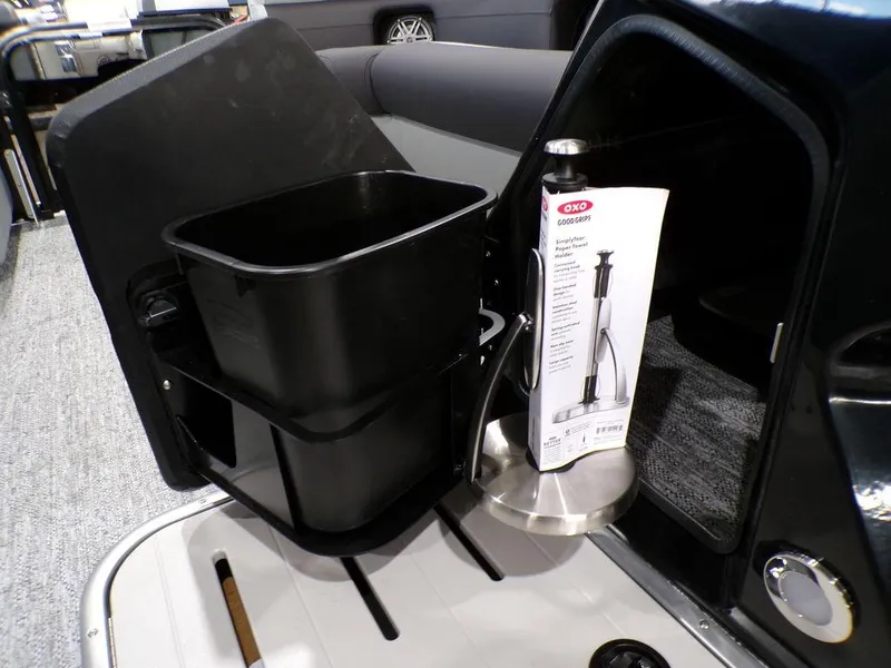 Slide: The Image of Interior of 2025 Premier 230 Sunsation RL with storage compartment and accessories. - 2