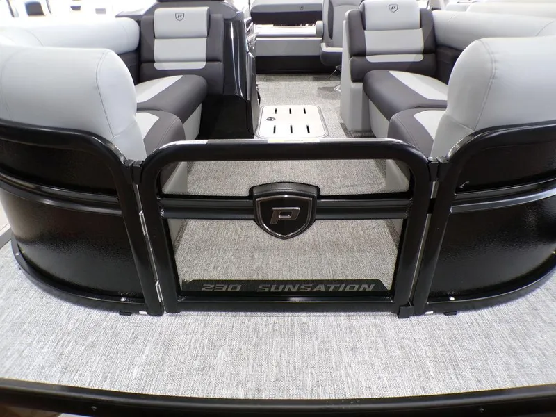 Slide: The Image of 2025 Premier 230 Sunsation RL pontoon boat interior with gray seating and black accents. - 21
