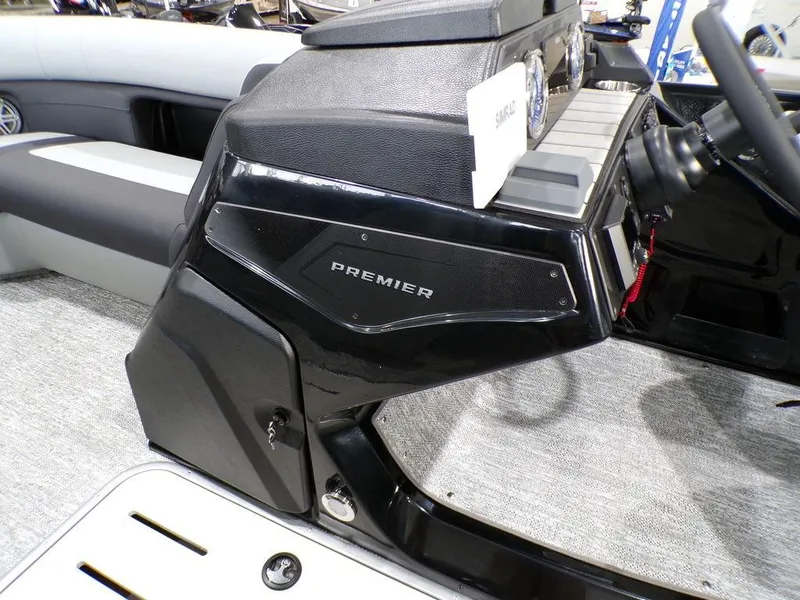 Slide: The Image of 2025 Premier 230 Sunsation RL boat dashboard with sleek black design and modern controls. - 4