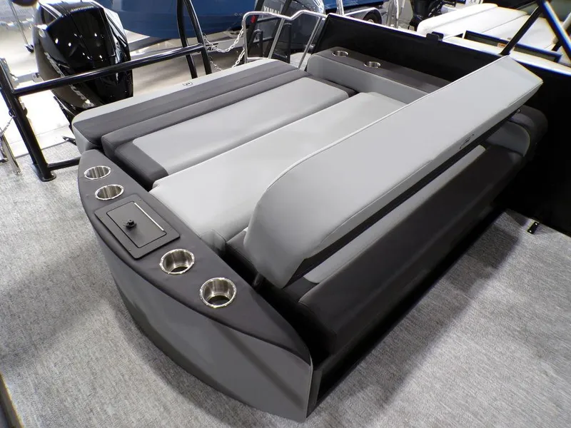 Slide: The Image of 2025 Premier 230 Sunsation RL boat interior with gray seating and cup holders. - 5