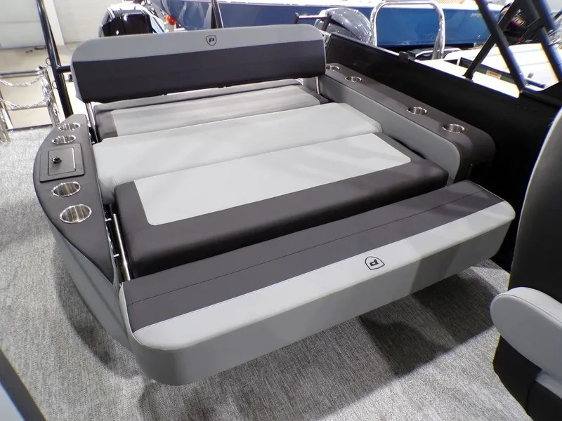 Slide: The Image of 2025 Premier 230 Sunsation RL boat interior with gray seating and cup holders. - 7