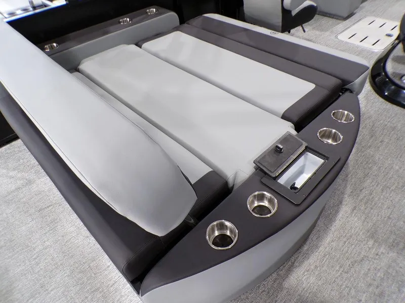 Slide: The Image of Luxury seating on 2025 Premier 230 Sunsation RL boat with cup holders and sleek design. - 8