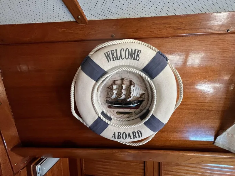 Slide: The Image of Decorative life preserver with ship model on Cheoy Lee Offshore 33, 1978. - 26