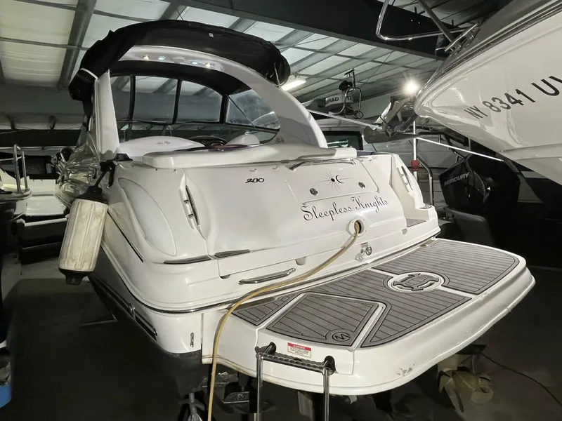 Slide: The Image of 2007 Sea Ray 280 Sundancer boat in storage, rear view with swim platform. - 11
