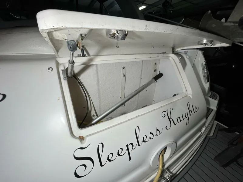 Slide: The Image of 2007 Sea Ray 280 Sundancer boat with "Sleepless Knights" name on the stern. - 12